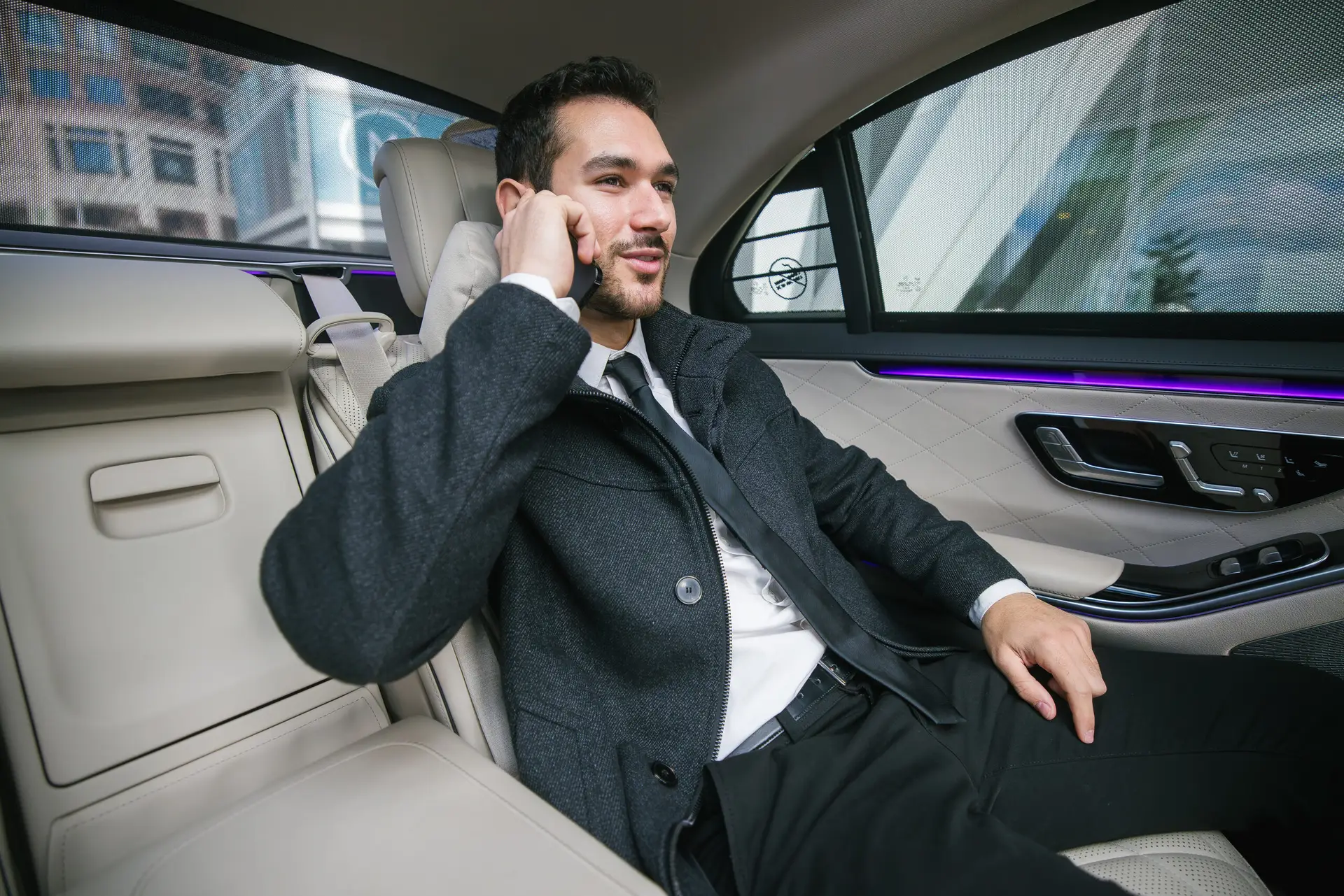 Businessman enjoying comfortable ride in Executive-Car-Hire-London